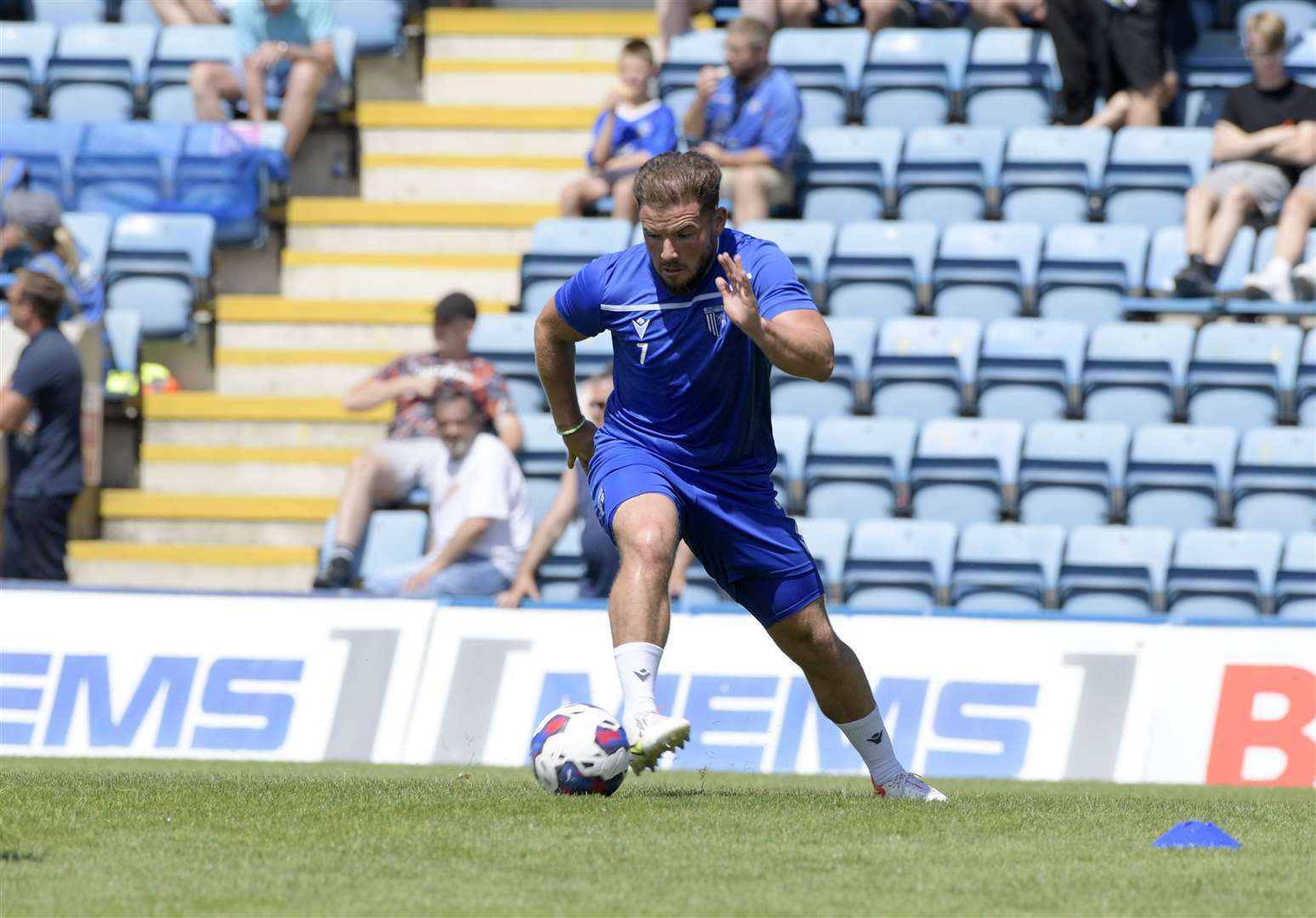 Alex MacDonald warms up at half-time in Gillingham's weekend game against Portsmouth Picture: Barry Goodwin