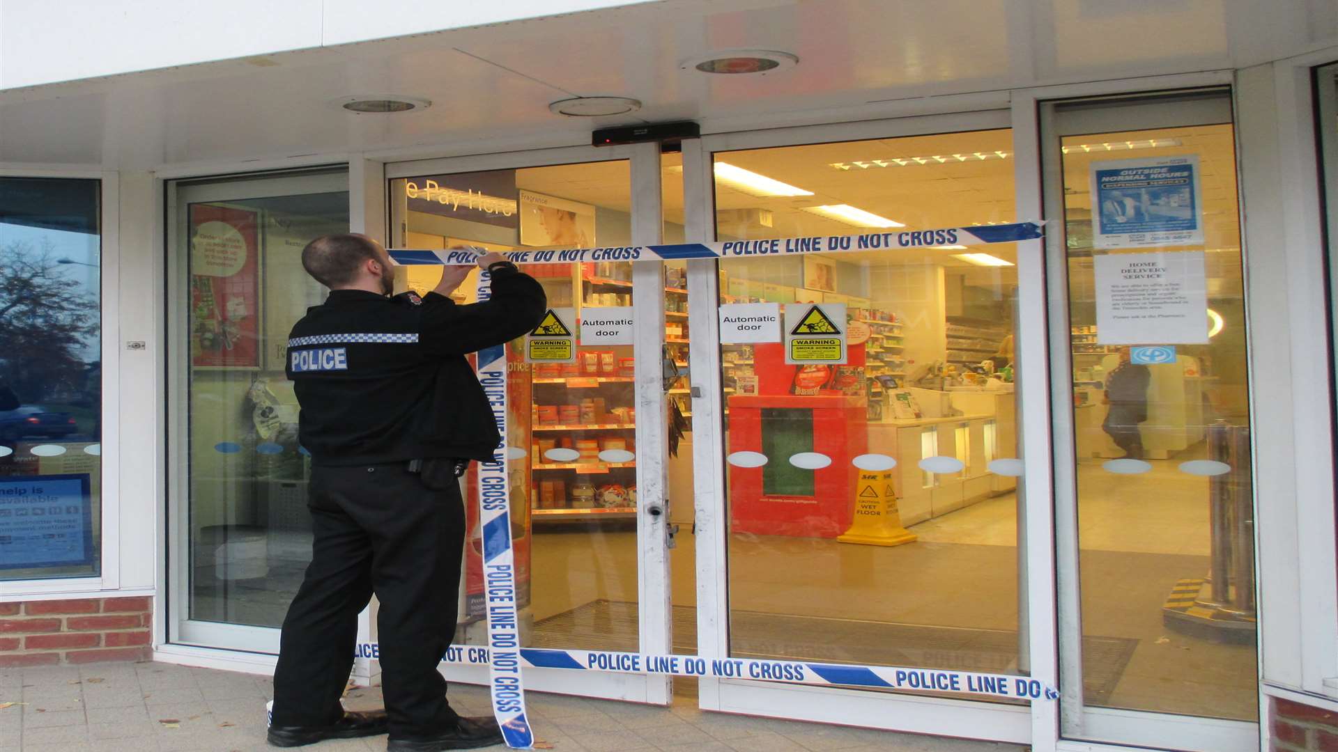 Police securing the door to Boots in Tenterden. Picture courtesy of @TenterdenTown
