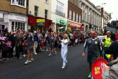 The Olympic torch is carried through Maidstone