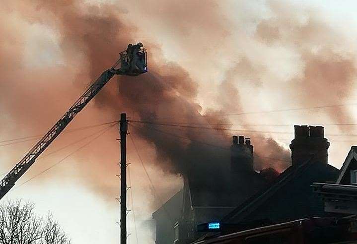 Fire crews used an extended platform to fight the flames. Picture: Julie Hollis