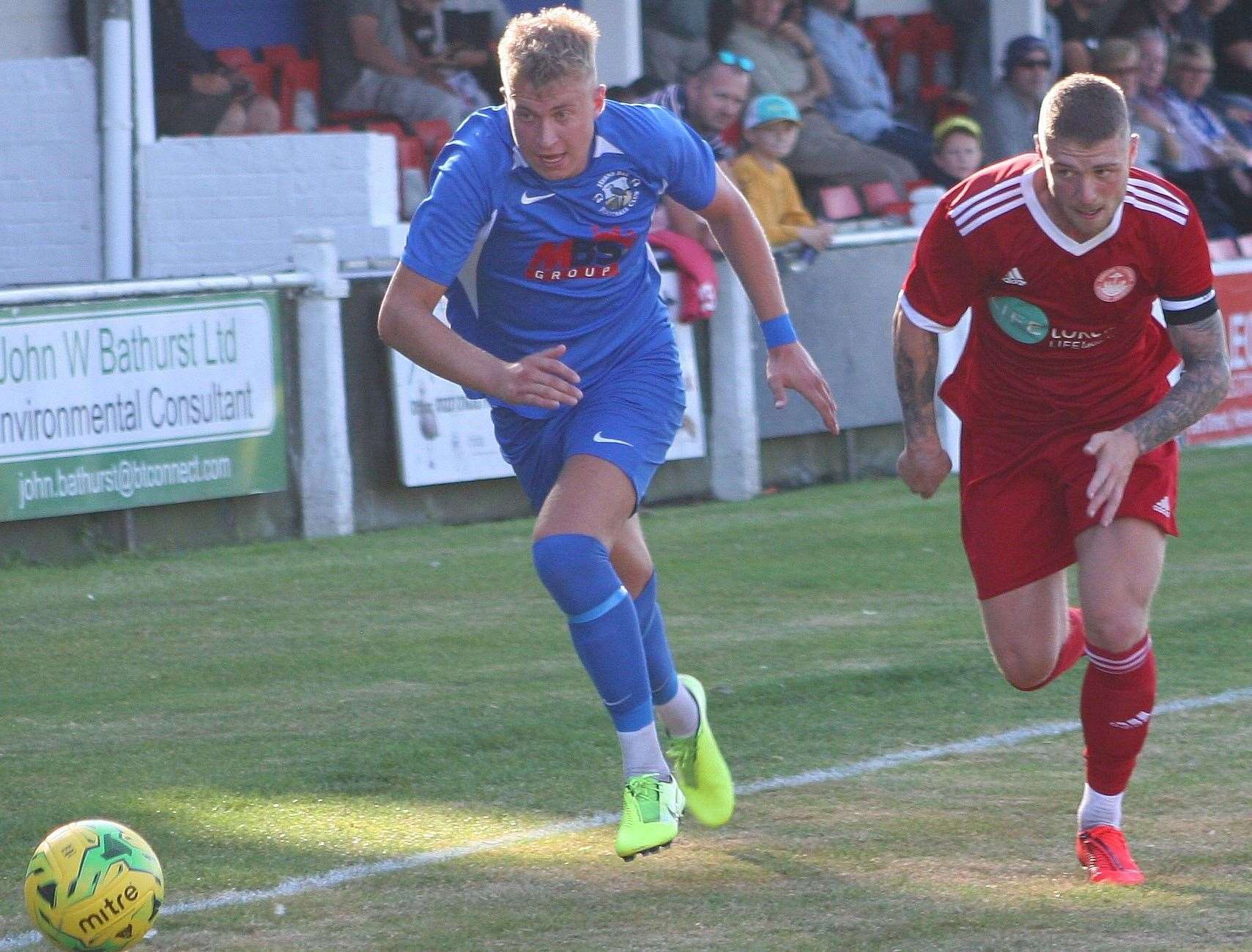 Hythe skipper Charlie Webster pursues Herne Bay's Luke Griffiths at Winch's Field on Saturday Picture: Keith Davy