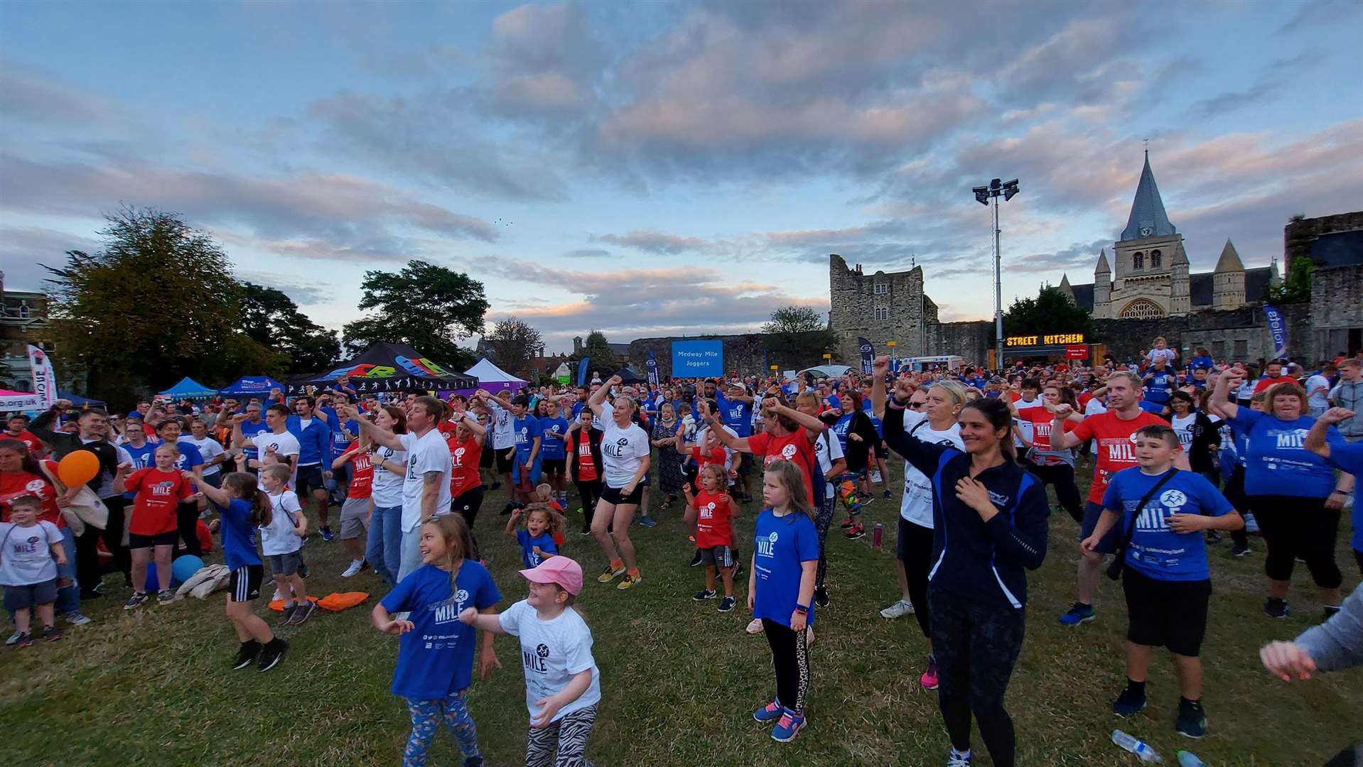 Medway Mile usually starts with a mass warm up in Rochester Castle Gardens