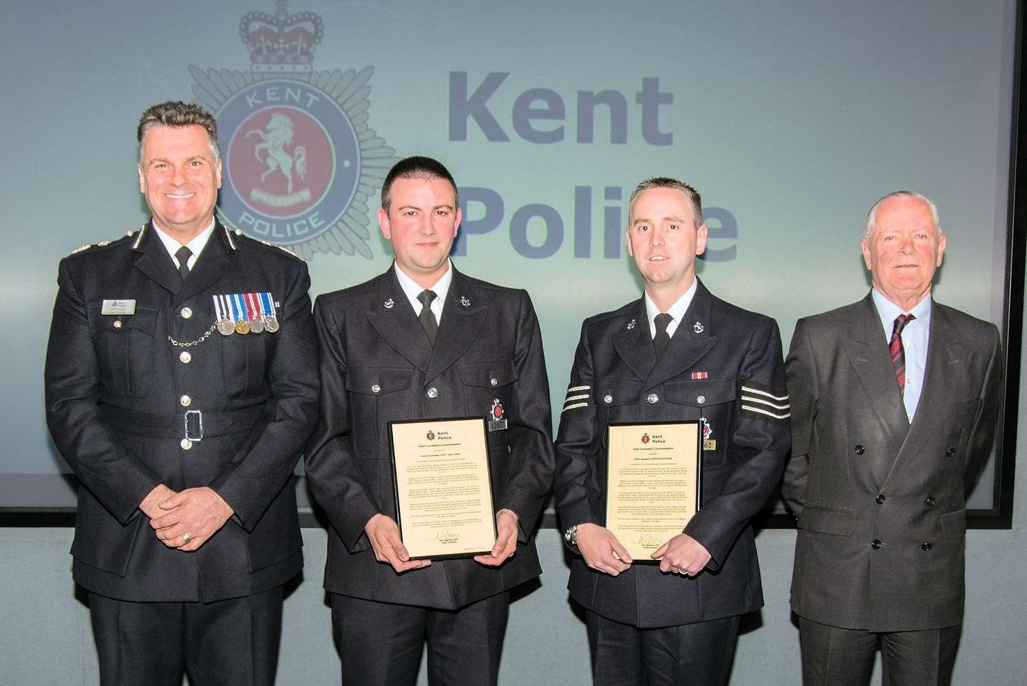 PC John Clarke and Sgt David Curtis with Chief Constable of Kent Police Alan Pughsley, far left, and Mike Hill, chairman of the Kent Police and Crime Panel, far right. Picture: Kent Police
