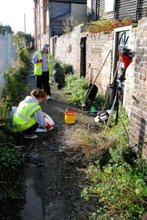 Volunteers clear an alleyway off Trinity Square during a previous Clean Sweep