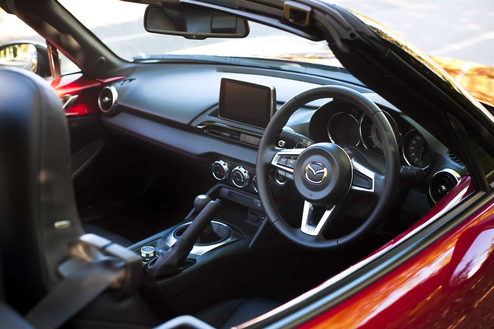 The no-fuss cockpit is reminiscent of the first MX-5