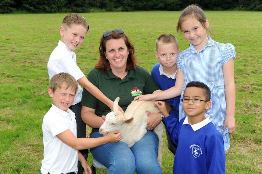 Abby Brindley from the Mobile Farm Experience with a goat and Freddie Taylor 9, Henry-George Eastwood 9, Tristian Latimer 9, Florence Sweeney 8, Raph Hamilton 9.