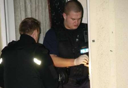 Police officers searching for evidence during one of the raids. Picture: NICK JOHNSON