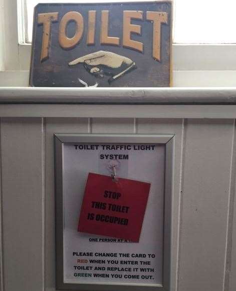 The toilet traffic light system is self-explanatory and works well, provided everyone remembers to turn the card over