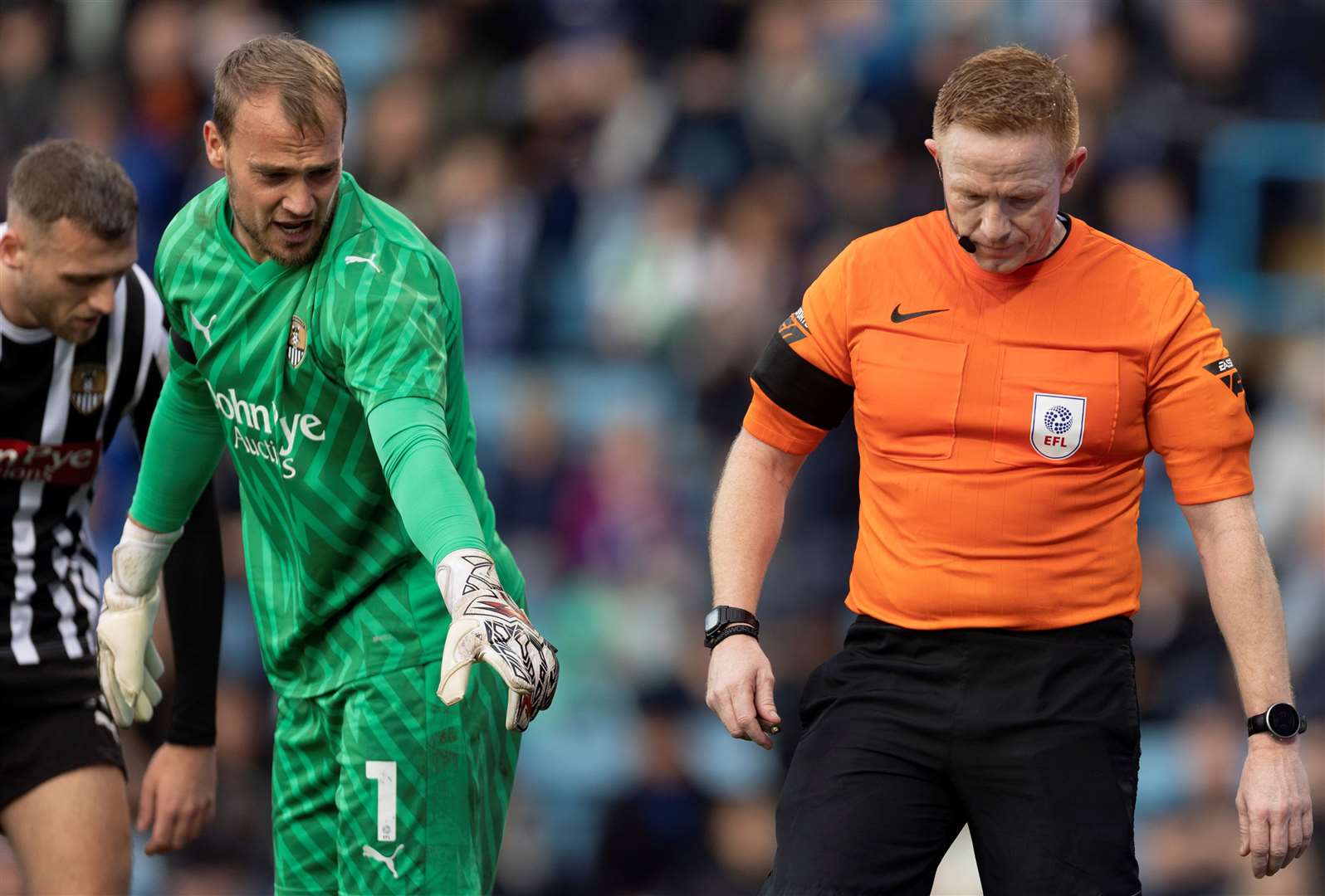 Goalkeeper Sam Slocombe received a cut to the head at Priestfield on Saturday and points to an object thrown Picture: @Julian_KPI