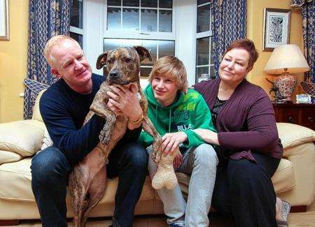 Jim and Veronica McKnight and their 17-year-old son James with Fenton, now renamed Munro, who was Battersea Dogs’ Home’s longest resident after spending a record 401 days there