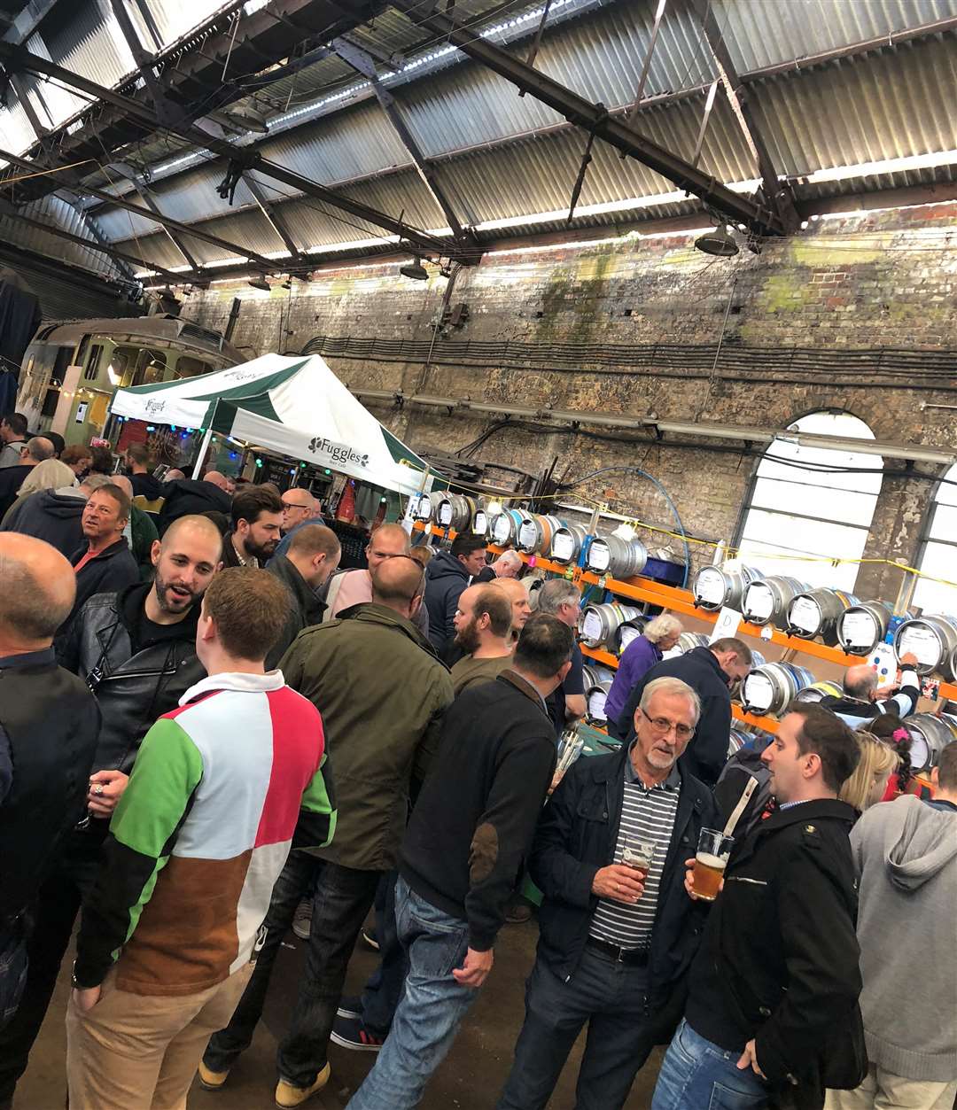 Ale-lovers in the engine shed enjoying a previous festival