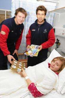 Kent players Matt Coles and Paul Dixey give a present to Christine Norris, 15, from Herne Bay
