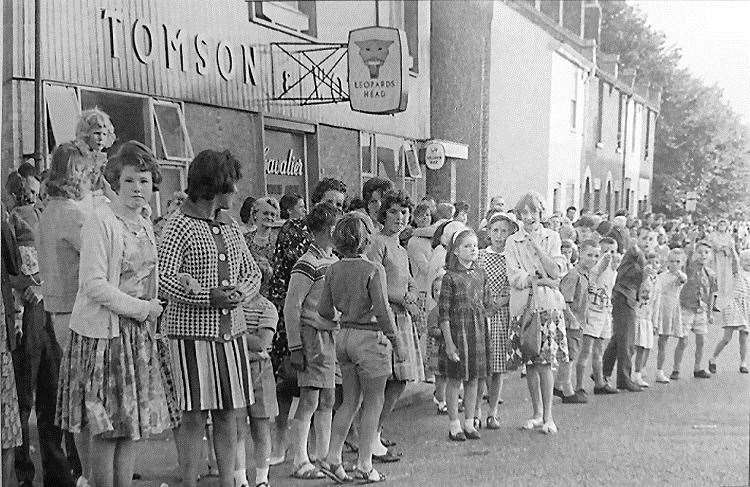 Crowds outside the Leopard's Head pub in Canterbury in 1963 waiting for the carnival procession. Picture: dover-kent.com