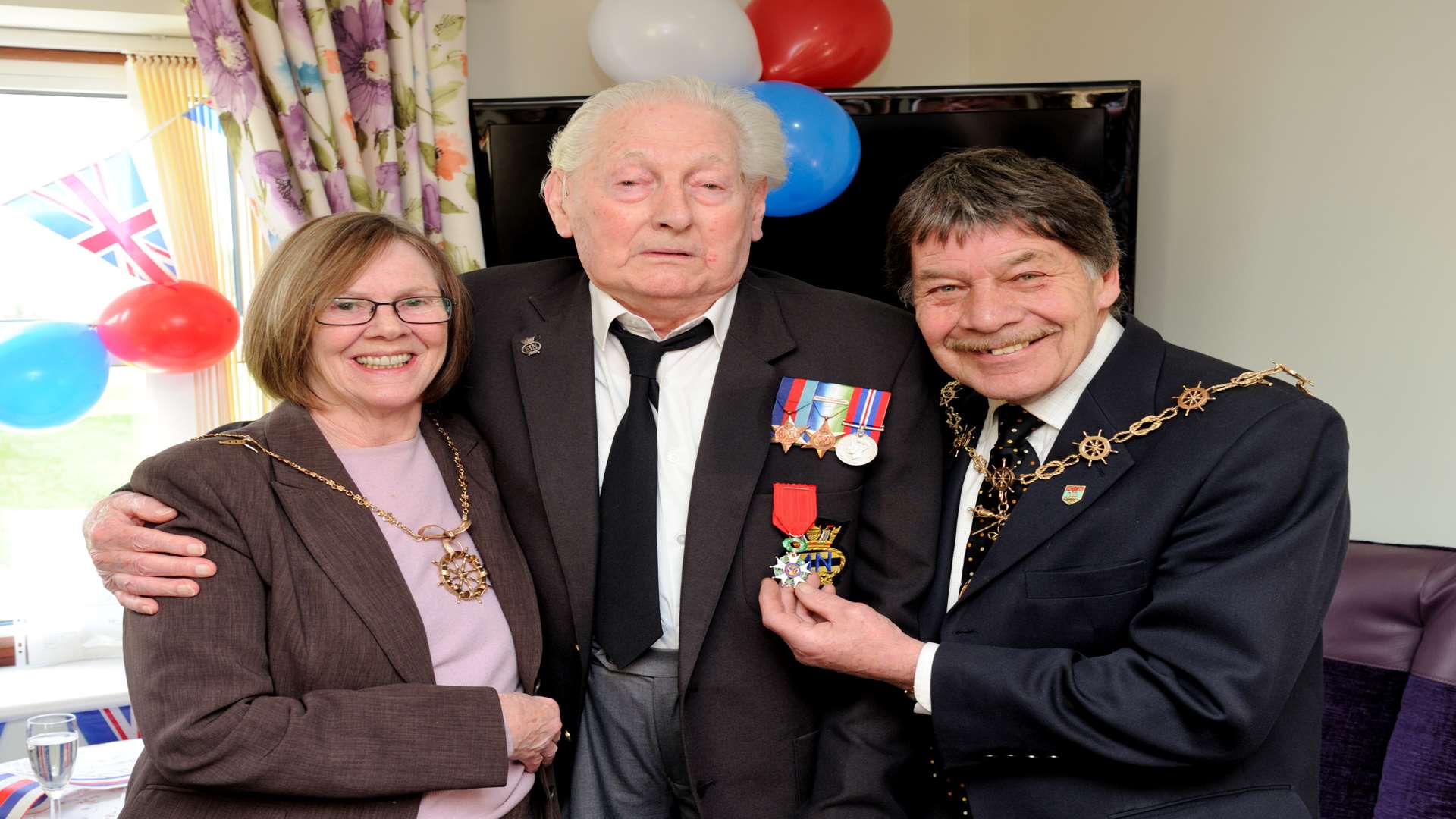 John (Jack) Roots presented with the legion of honour. Jack with the Gravesham Mayoress and Mayor Fiona Strike & Mike Wenban.