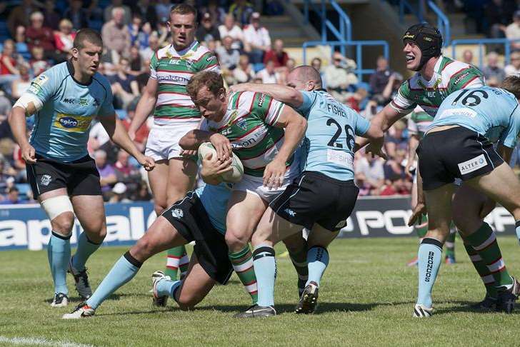 London Broncos struggle to contain another Warrington Wolves attack during the game at Priestfield Stadium in June