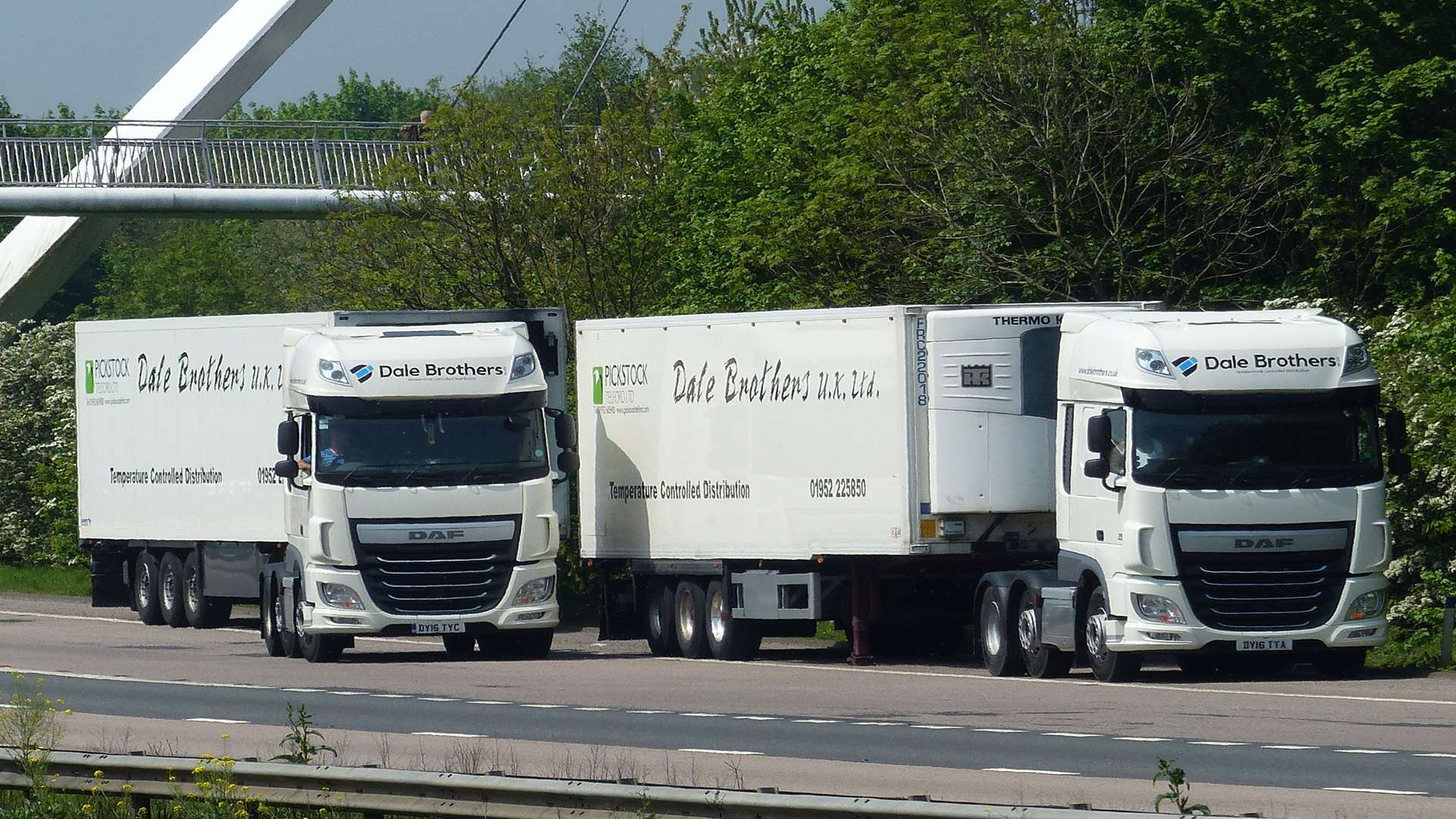 The lorry drivers swapped trailers on the motorway slip road