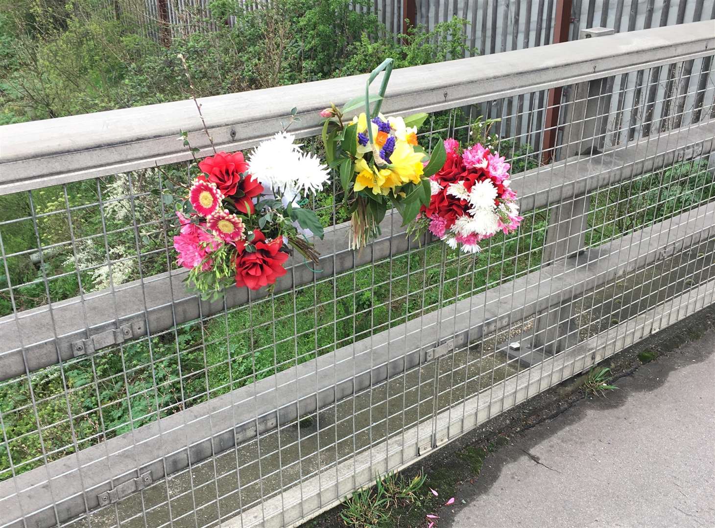 Flowers left on Lunsford Lane bridge in Larkfield in memory of Paul Bradshaw
