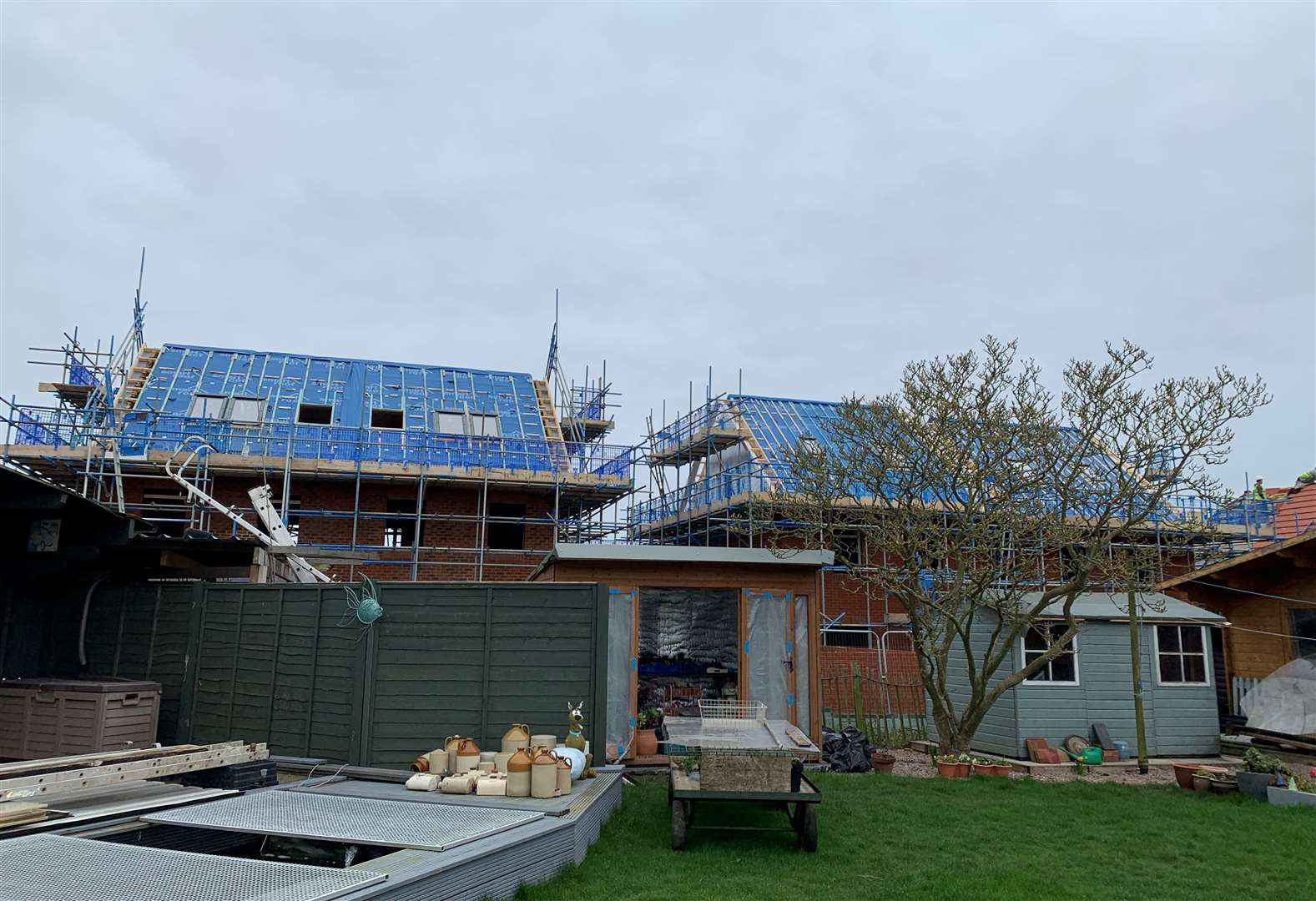 The new Barratt David Wilson Homes properties tower over their garden in Broad Oak, near Canterbury