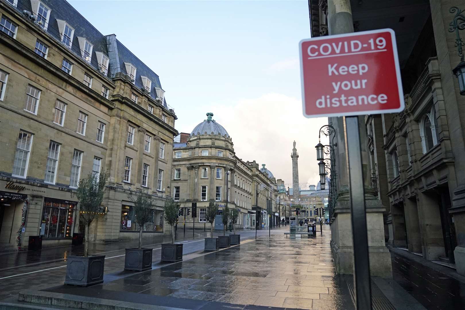 High streets are deserted as new lockdown measures are introduced (Owen Humphreys/PA)