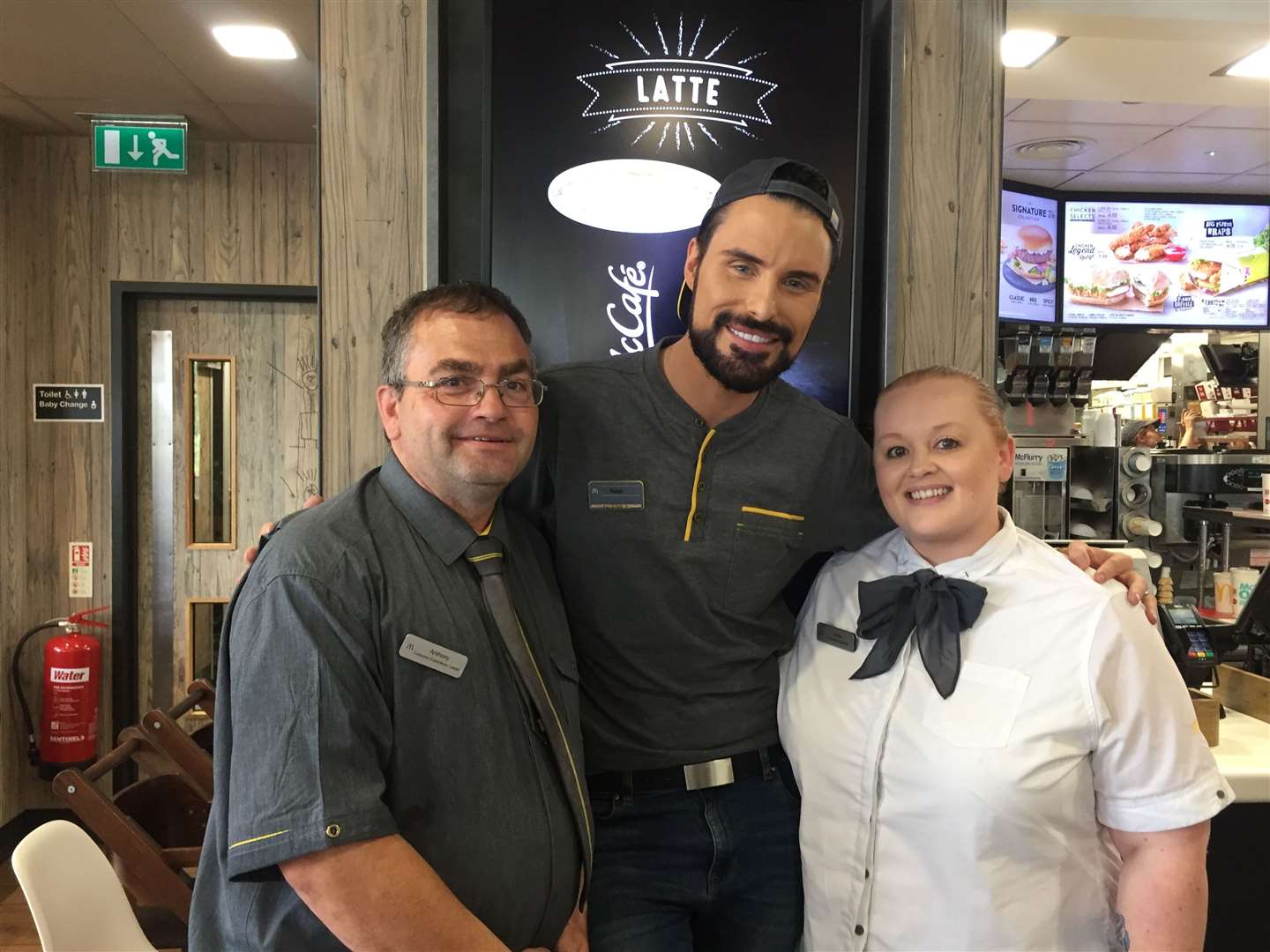 Rylan Clark-Neal with Anthony Trice, customer experience leader, and Hollie Weeks, first assistance manager (12573694)