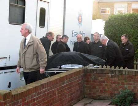 A second body is removed from 50 Irvine Drive, Margate, on Friday. Picture: KIM SANDERS