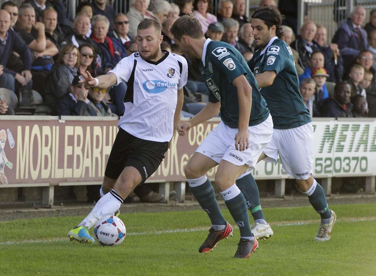 Dartford goalscorer Ryan Hayes takes on two Macclesfield players Picture: Andy Payton