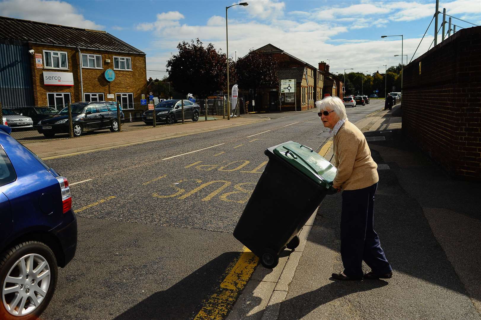 Mrs Niller pushing her wheelie bin from her house to the Serco bin depot. Picture: Alan Langley