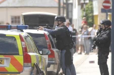 The scene in Harbour Street, Whitstable, on Saturday when police surrounded a flat