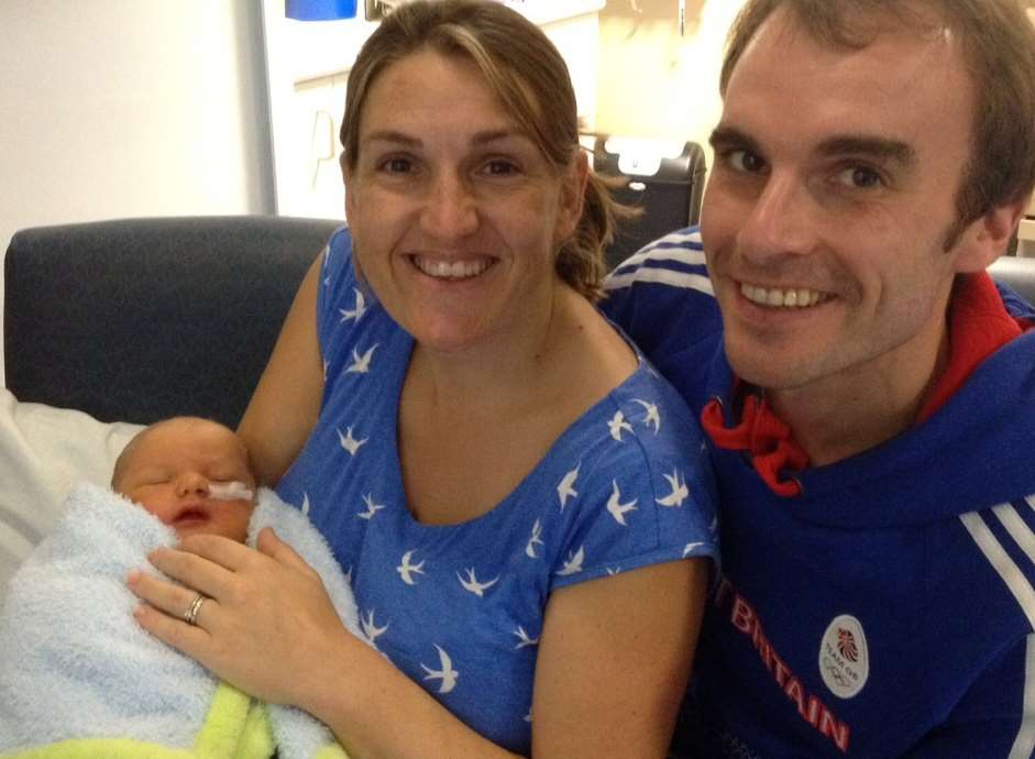 Rebecca Buckingham and husband Chris Buckingham holding their son Theo for the first time