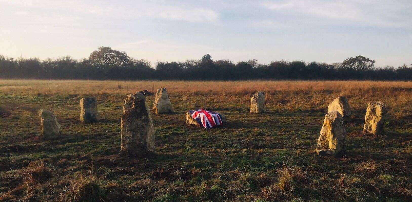 A Union Jack flag draped on the centre stone for Remembrance Sunday