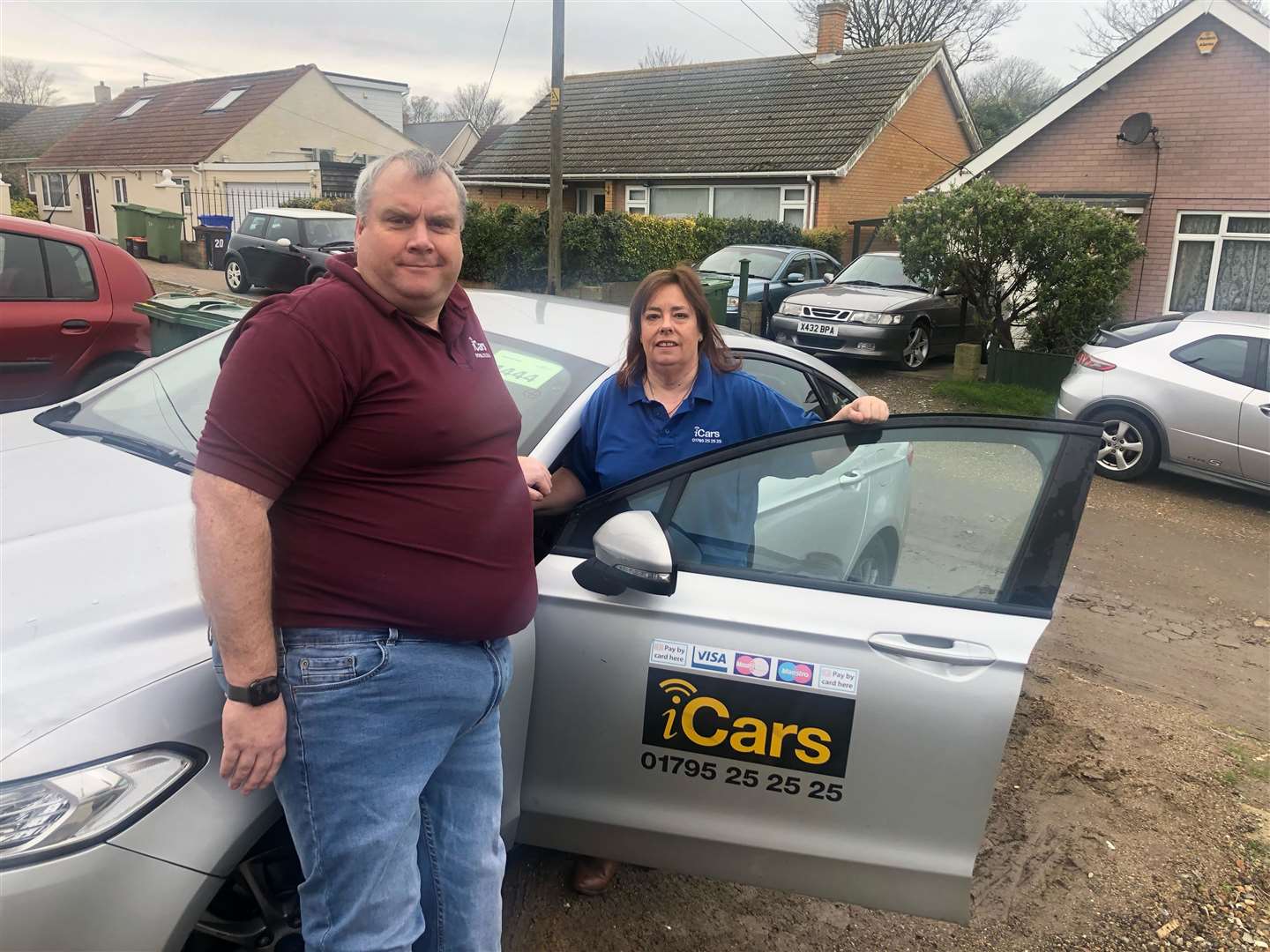 Neil McLennan from cab company iCars and taxi driver Janice Crawford