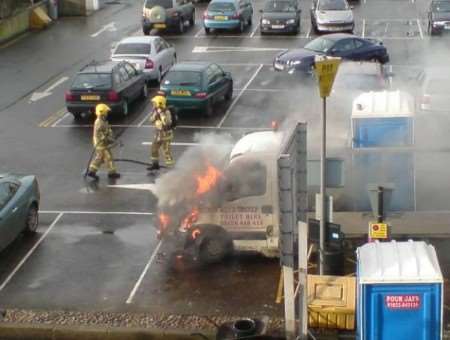 Firefighters tackle the truck blaze. Picture: Kim Woolsgrove