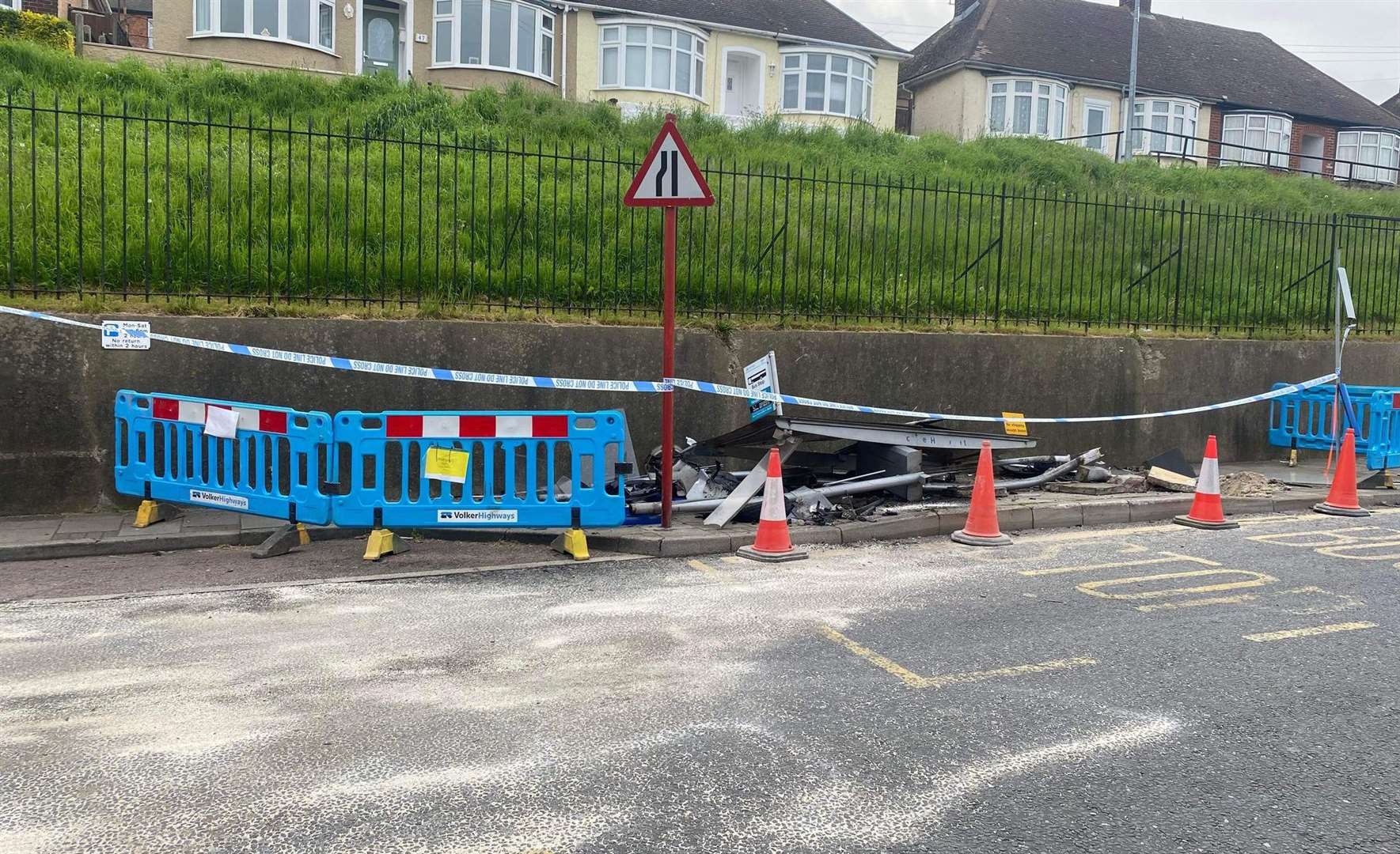 The bus stop in Delce Road after a car involved in a police chase crashed into it