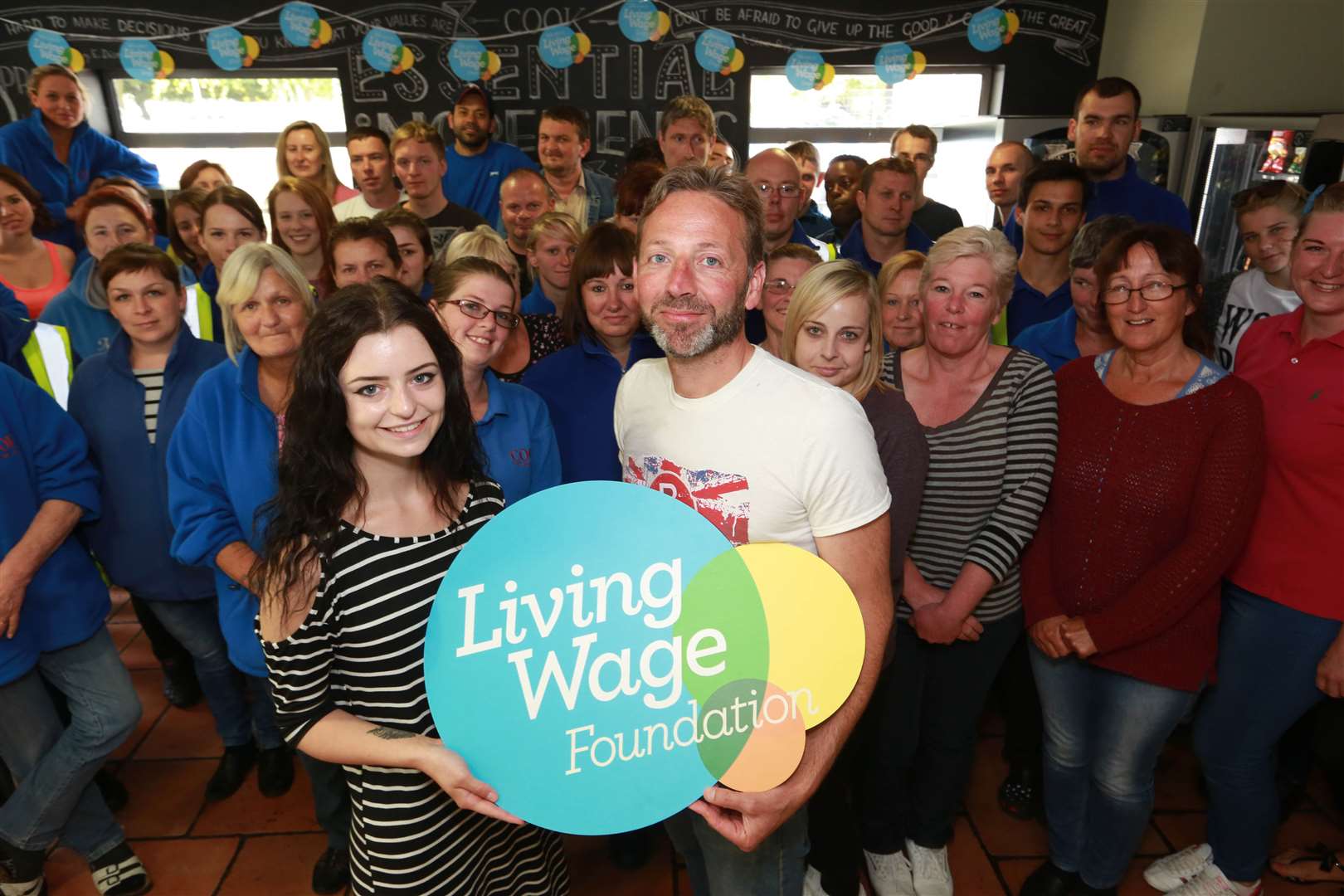 Cook founder Edward Perry receives his firm's accreditation from the Living Wage Foundation