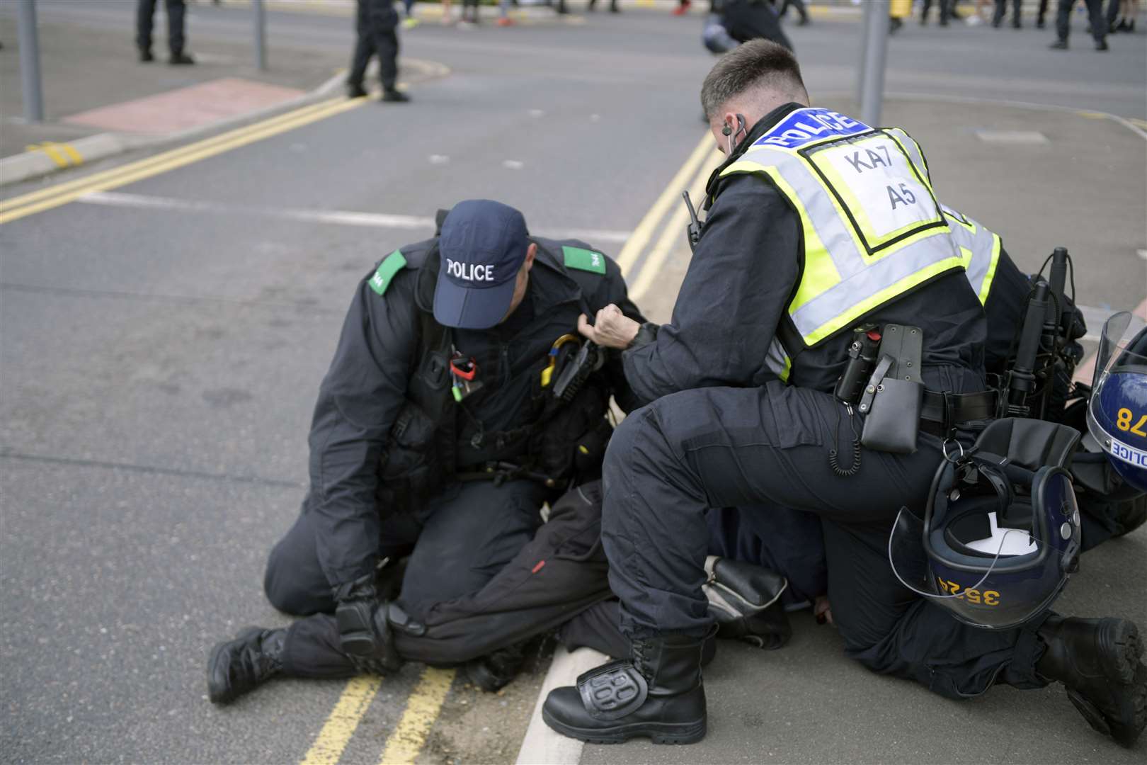 Officers detain a protester after trouble flares in Dover. Picture: Barry Goodwin
