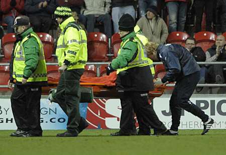 Romain Vincelot is carried away on a stretcher at Rotherham