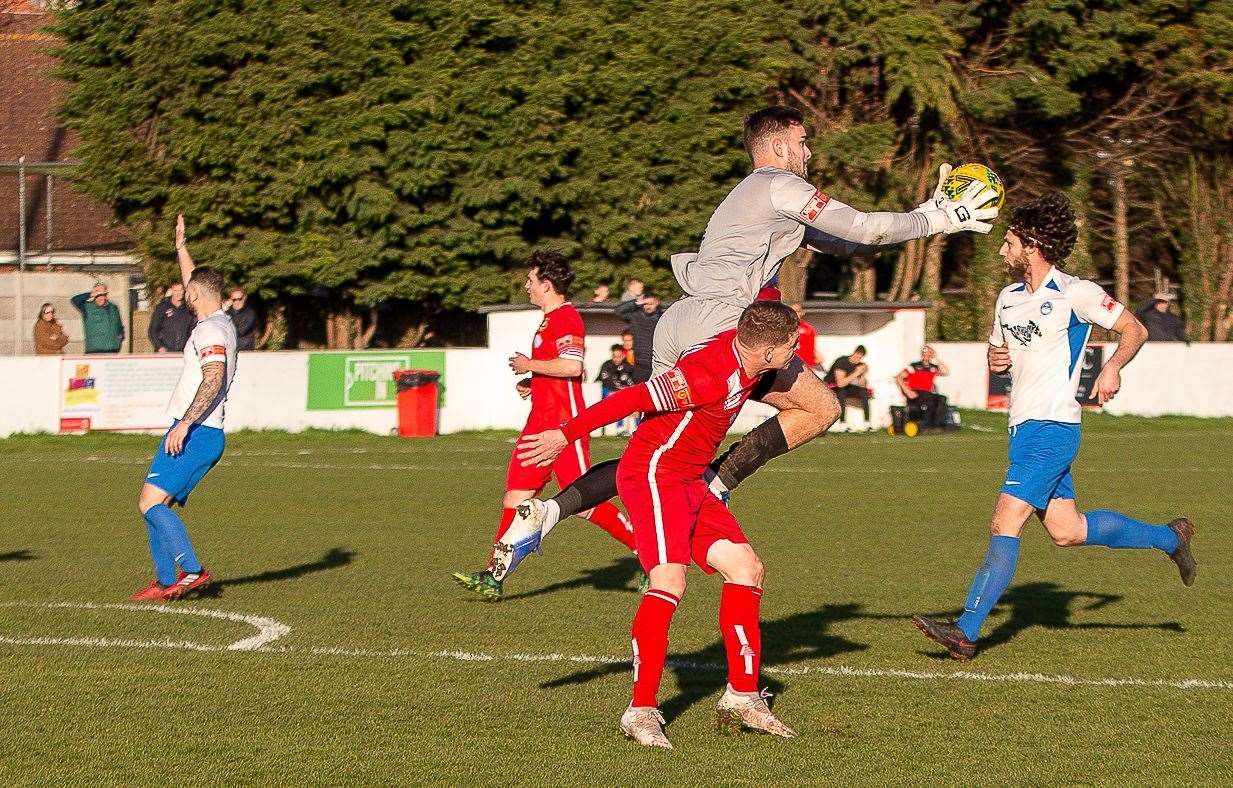 Hythe keeper Henry Newcombe beats Whitstable's Charlie Heatley to the ball during the Oystermen's 2-0 defeat, Keith McMahon's last match in charge. Picture: Les Biggs