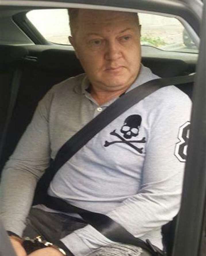 A photograph of Dalton in handcuffs following his arrest in Madrid, Spain, in 2018. Picture: Kent Police