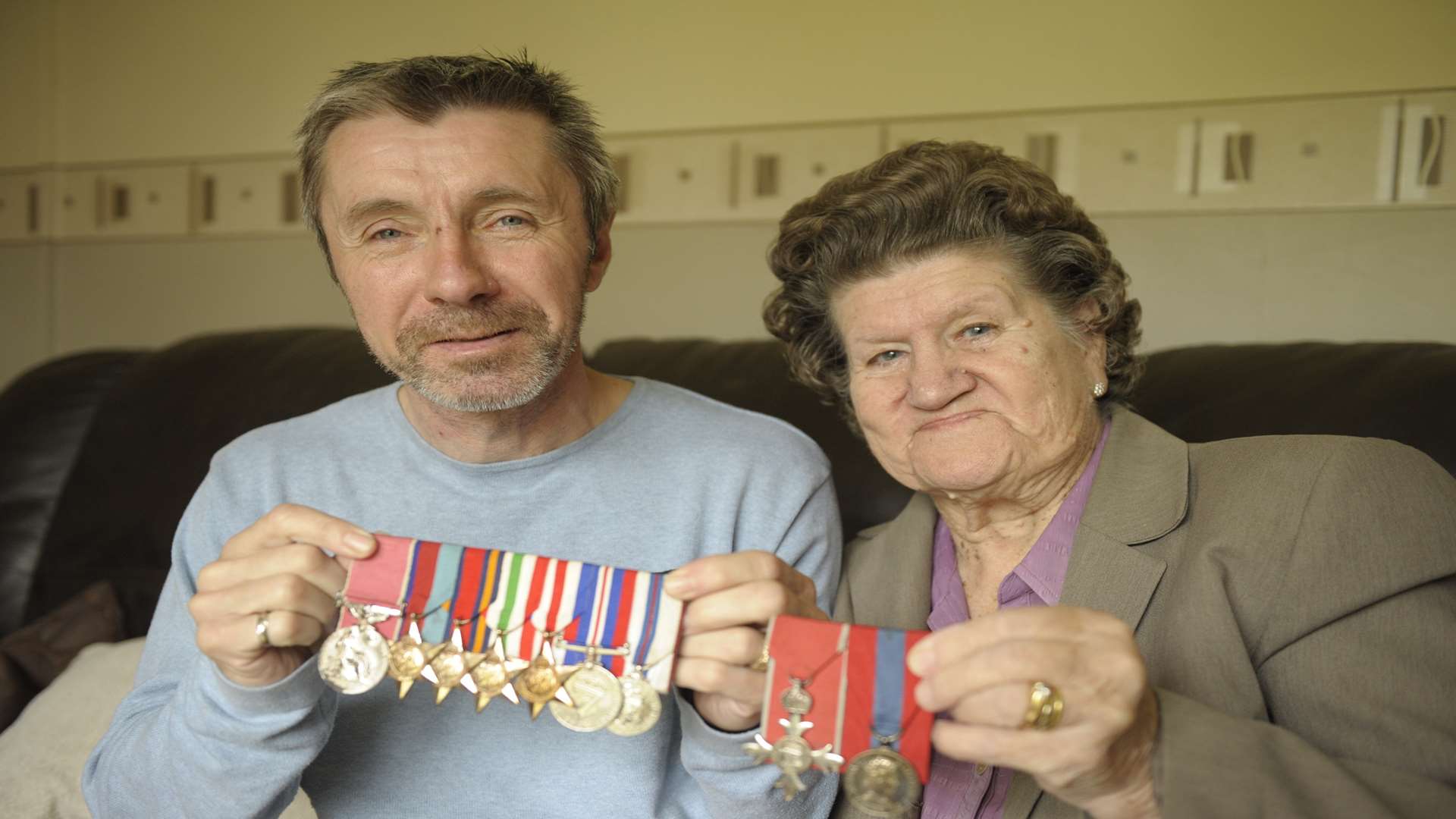 His son Mark with Joe's medals