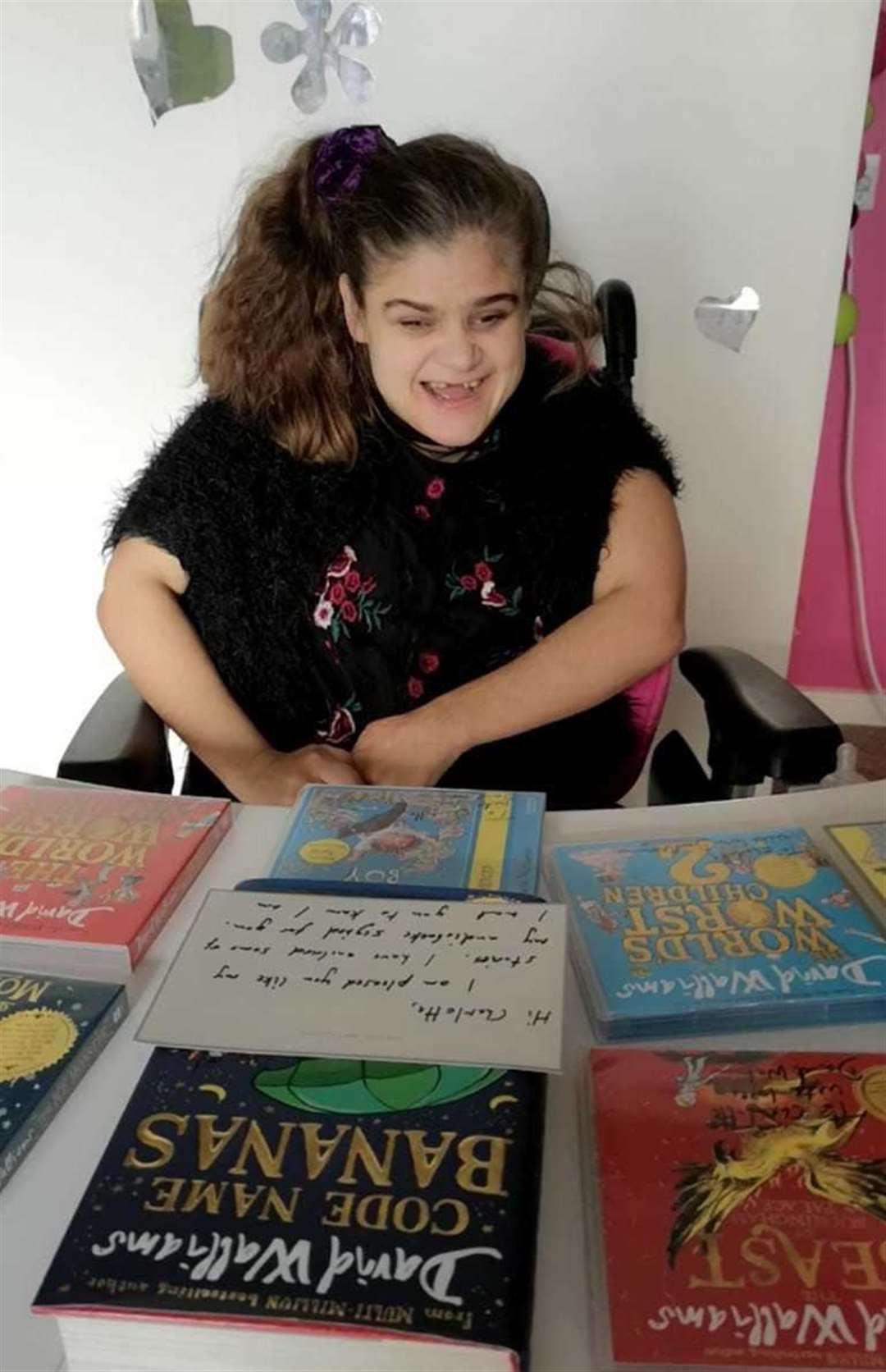 33-year-old Charlotte with her new audiobooks sent from David Walliams himself