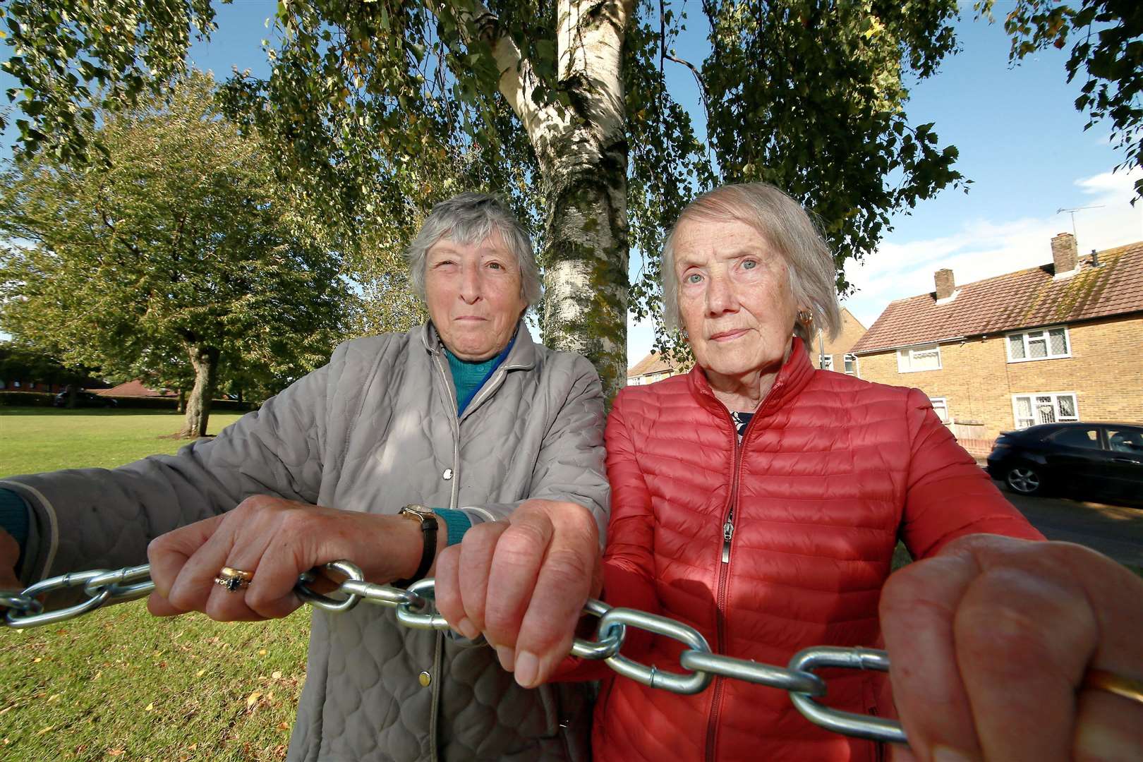 Olwen O'Dowd and her friend Margaret Fiest vowed to chain themselves to the trees in Woodchurch Crescent, Twydall to stop them being bulldozed to make way for new houses. Picture: Phil Lee.