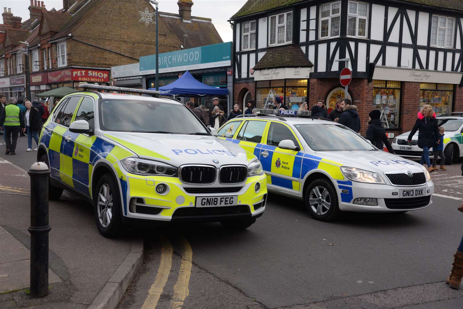 Police vehicles in Station Road close to the Christmas market and family fun day