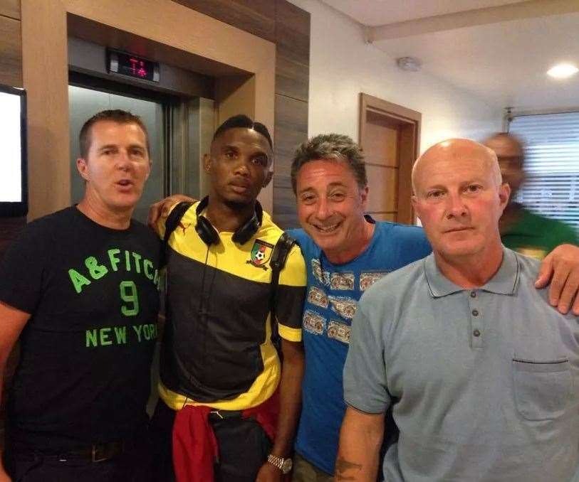 Sittingbourne builder Terry Matson (far right) meets Cameroon striker Samuel Eto'o (second left) in Brazil during the World Cup. Photo: Terry Matson