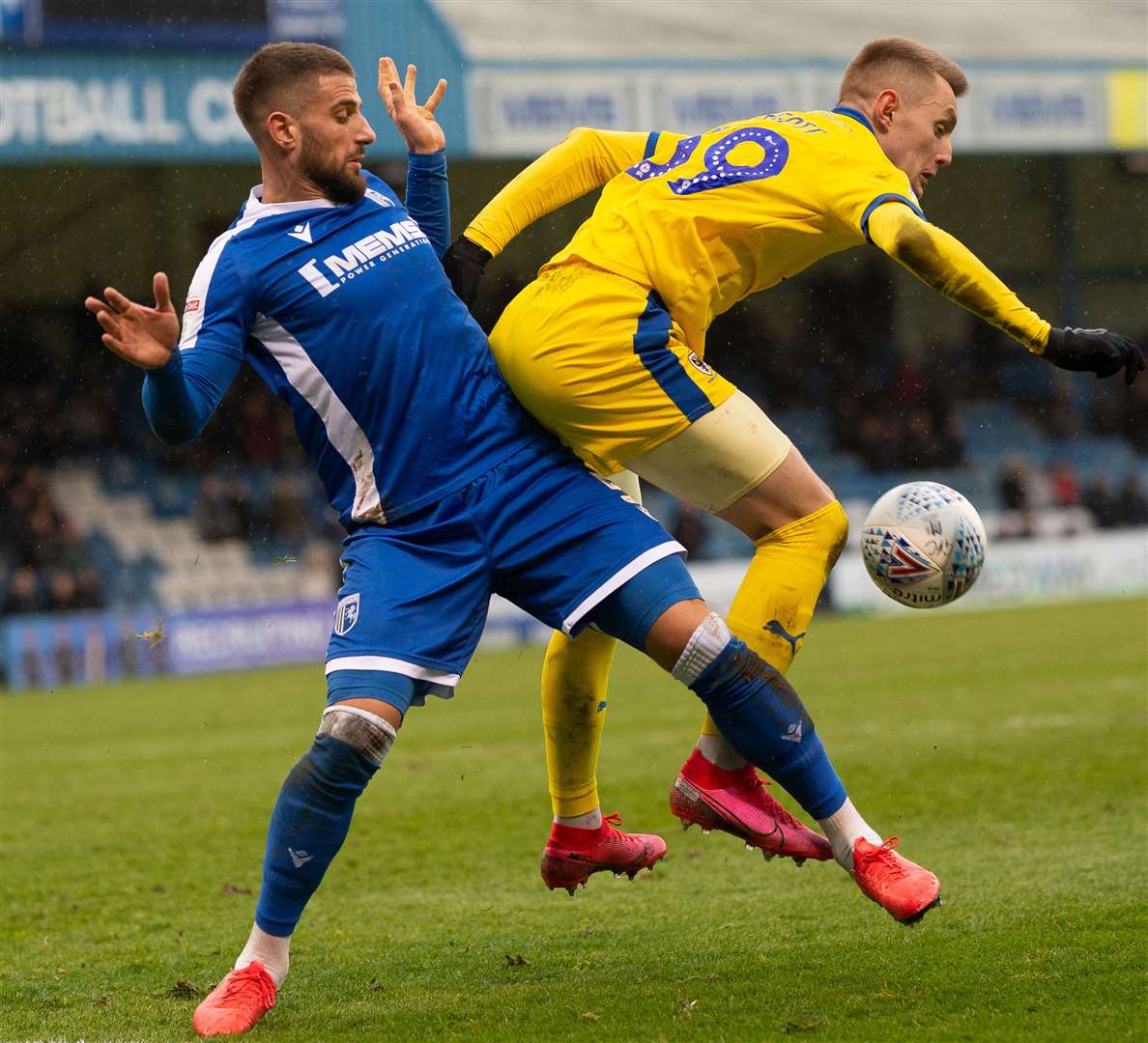 Max Ehmer and AFC Wimbledon's Joe Pigott challenge for the ball before Ehmer's afternoon ended early Picture: Ady Kerry