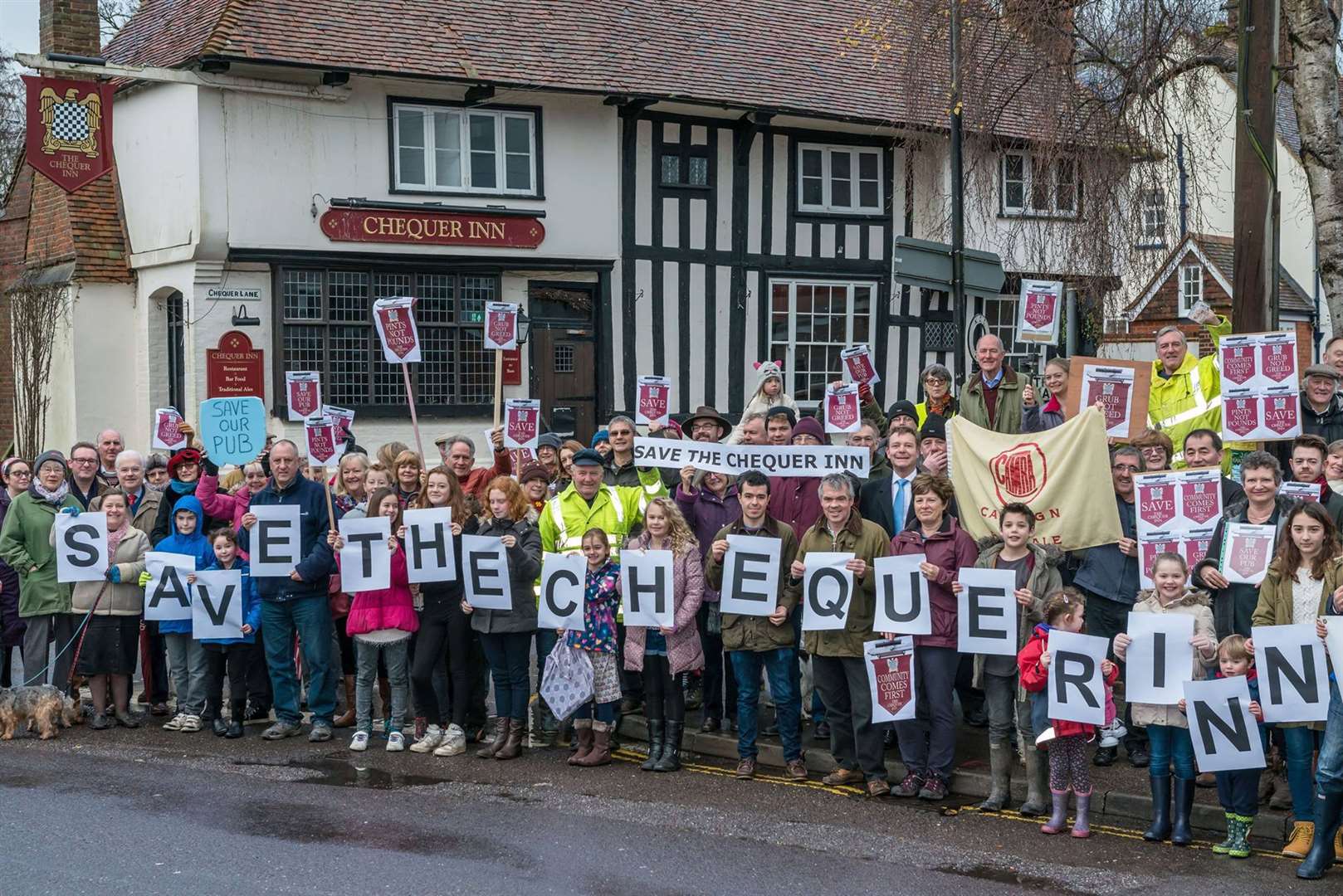 The continuing campaign to save the Chequer Inn. Demonstrators in 2016 when it was saved from housing. Picture courtesy of Matthew Titterton.