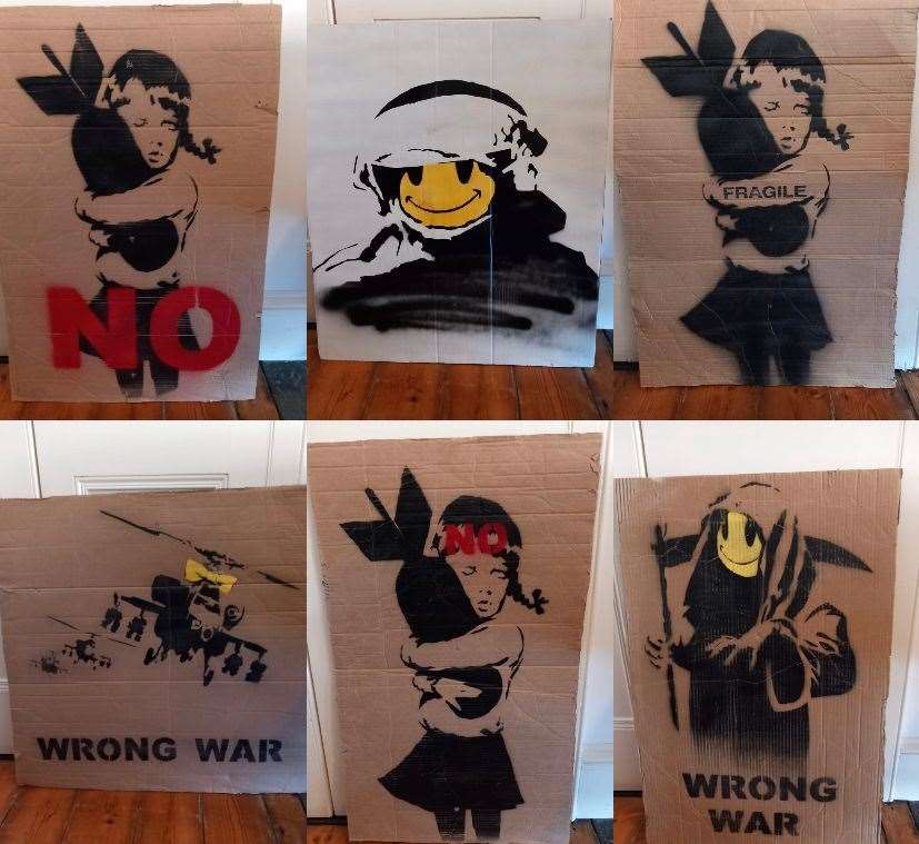 Jacob Smith's anti-war march placards by Banksy. Picture: Jacob Smith