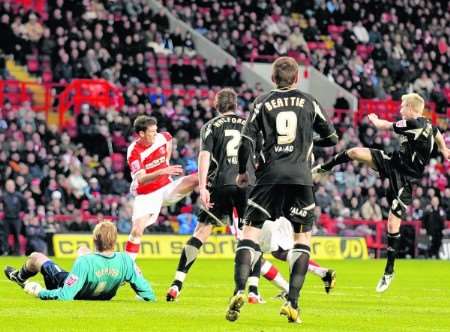 Nicky Weaver is left grounded as Matthew Kilgallon nets Sheffield United's third goal. Picture: Barry Goodwin