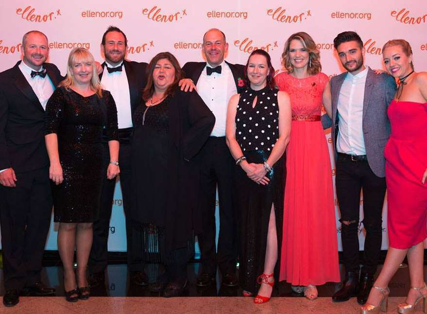 Hospice charity ellenor's annual Orange Ball raised a record £77,000. Patrons pose for a picture