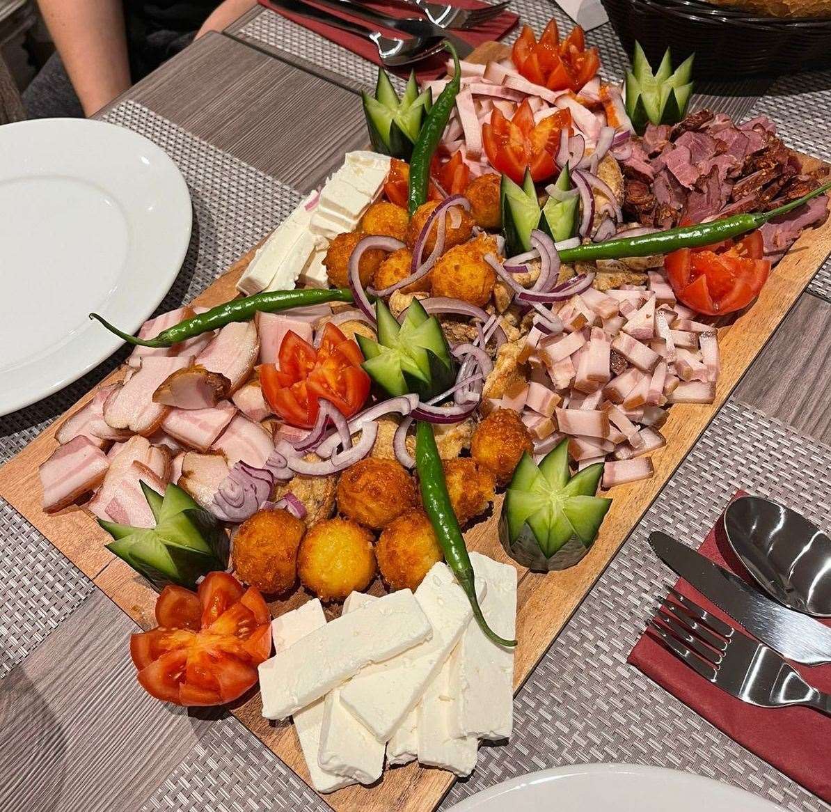 Cold traditional countryside platter including pork scathing, meatballs, ham, cheese aubergine salad, olives and vegetables. Picture: Vasile Conduraru