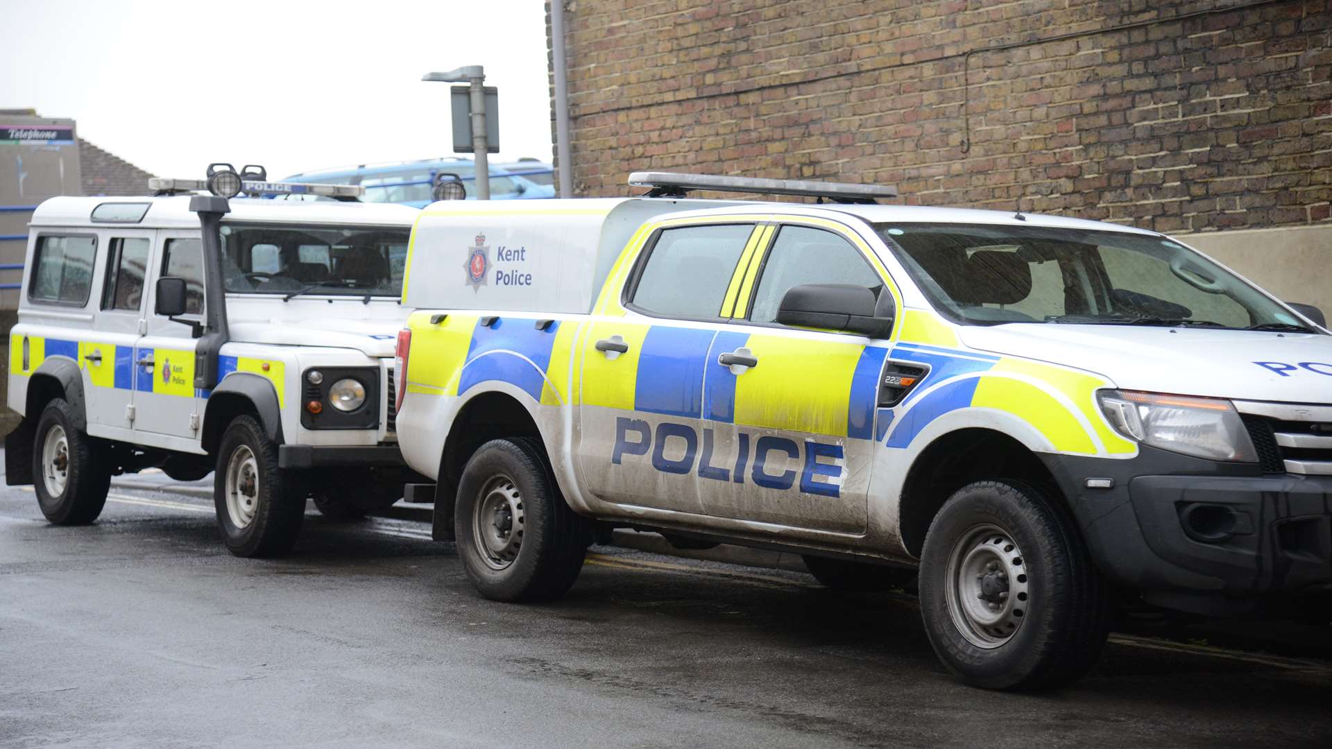 Police vehicles at the raid